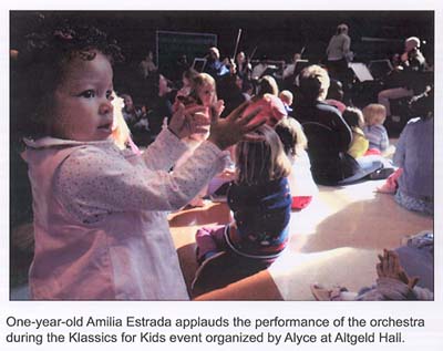 Amelia applauds the performance